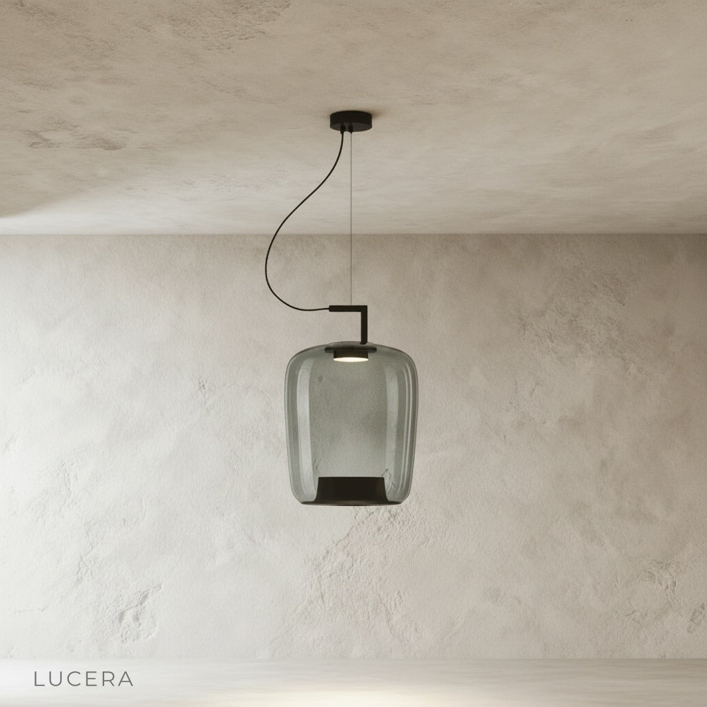 Yardang pendant light with soft ambient glow in bedroom corner beside upholstered bench