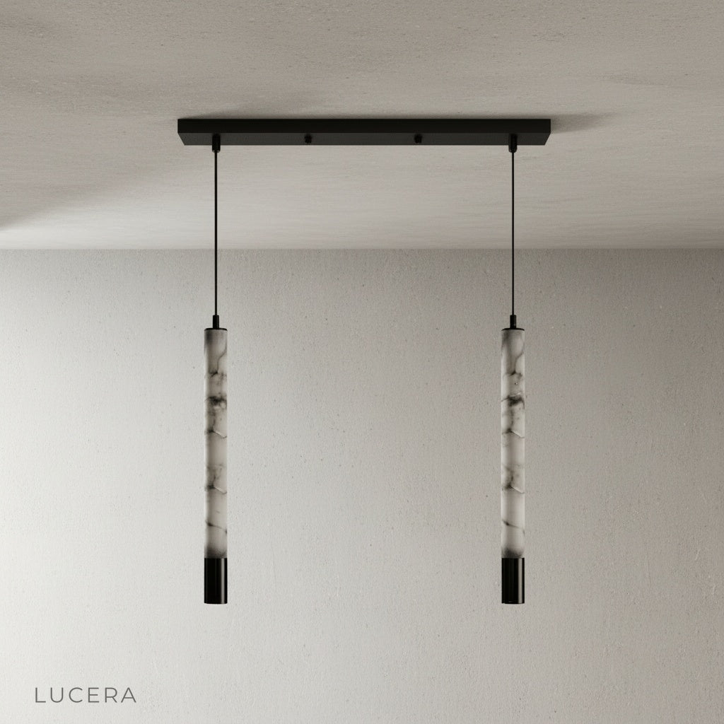 Yseult pendant light hanging in a hallway with warm alabaster glow and oak floor accents