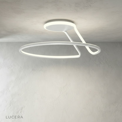 Loom ceiling light in contemporary dining room with wooden table