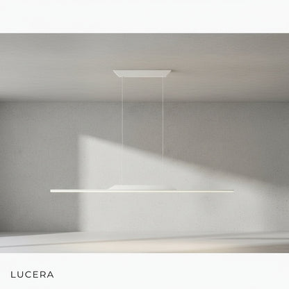 Vind gold and black chandelier in a minimalist hallway with white walls and concrete floor