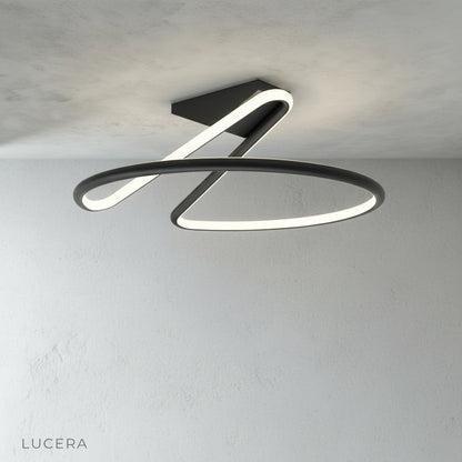 Loom ceiling light glowing at dusk in stylish living space