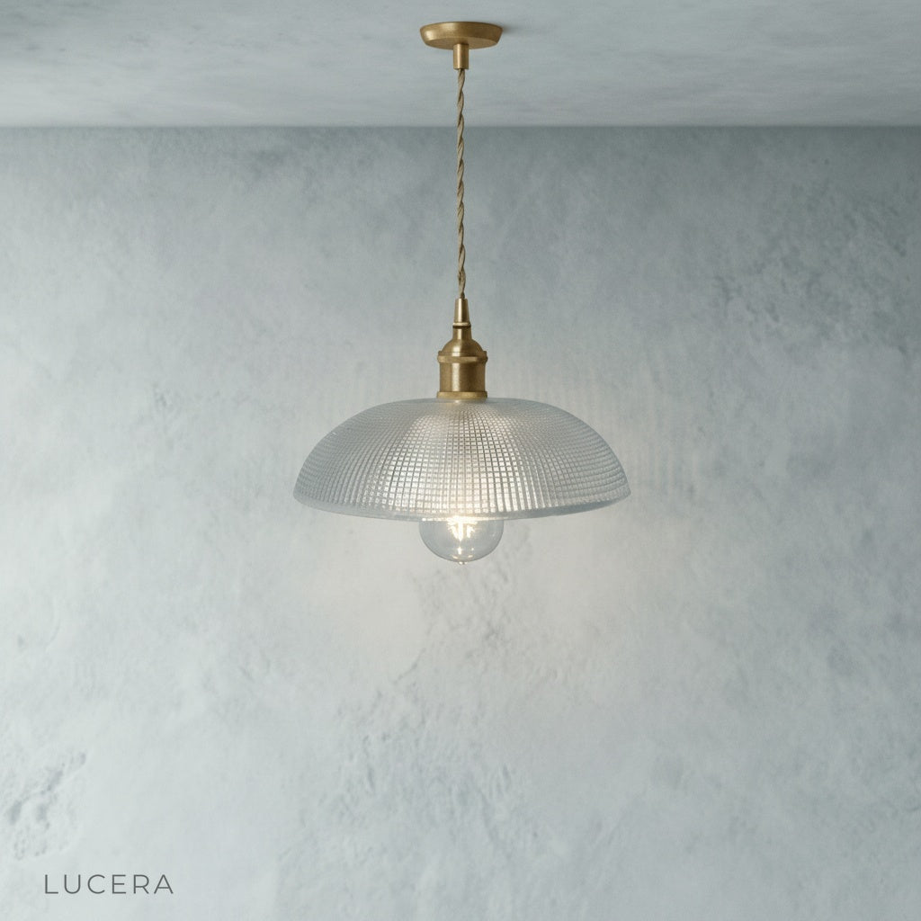 Harmony Pendant Light hanging low over bedside table in cozy reading nook with books