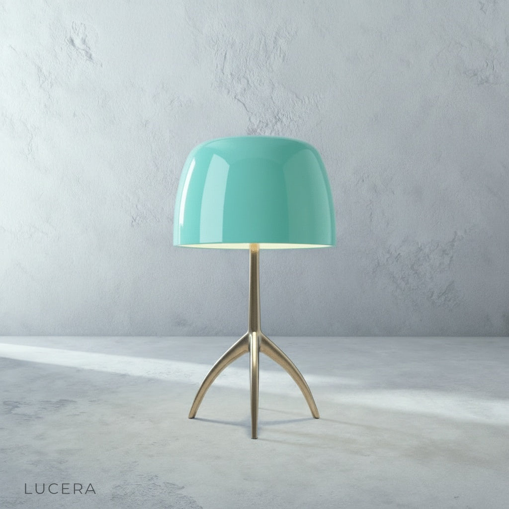 Albescent Table Lamp glowing at dusk on a patio side table with outdoor lounge furniture