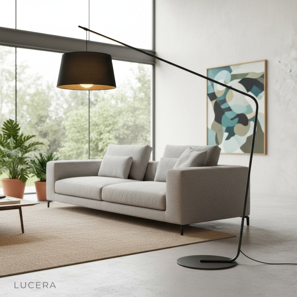 modern black floor lamp with round fabric shade beside armchair in cozy living room