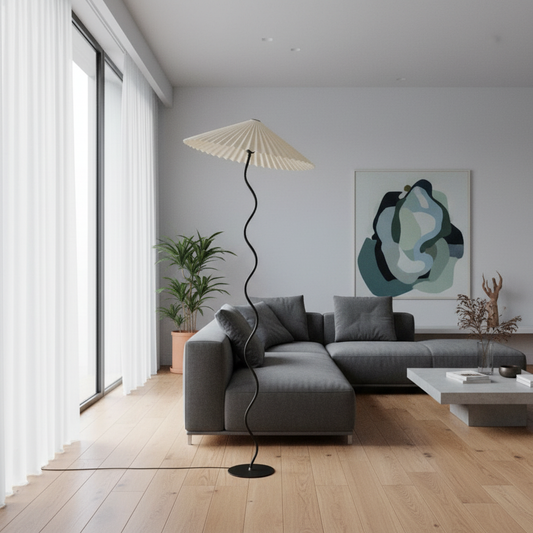Art deco Imogen floor lamp with pleated linen shade in cozy living room corner