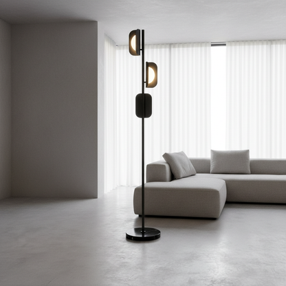 modern black and gold glacial floor lamp in bright living room with marble base