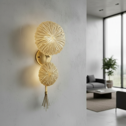 gold metal Sacro illuminated art lamp glowing on modern living room console table