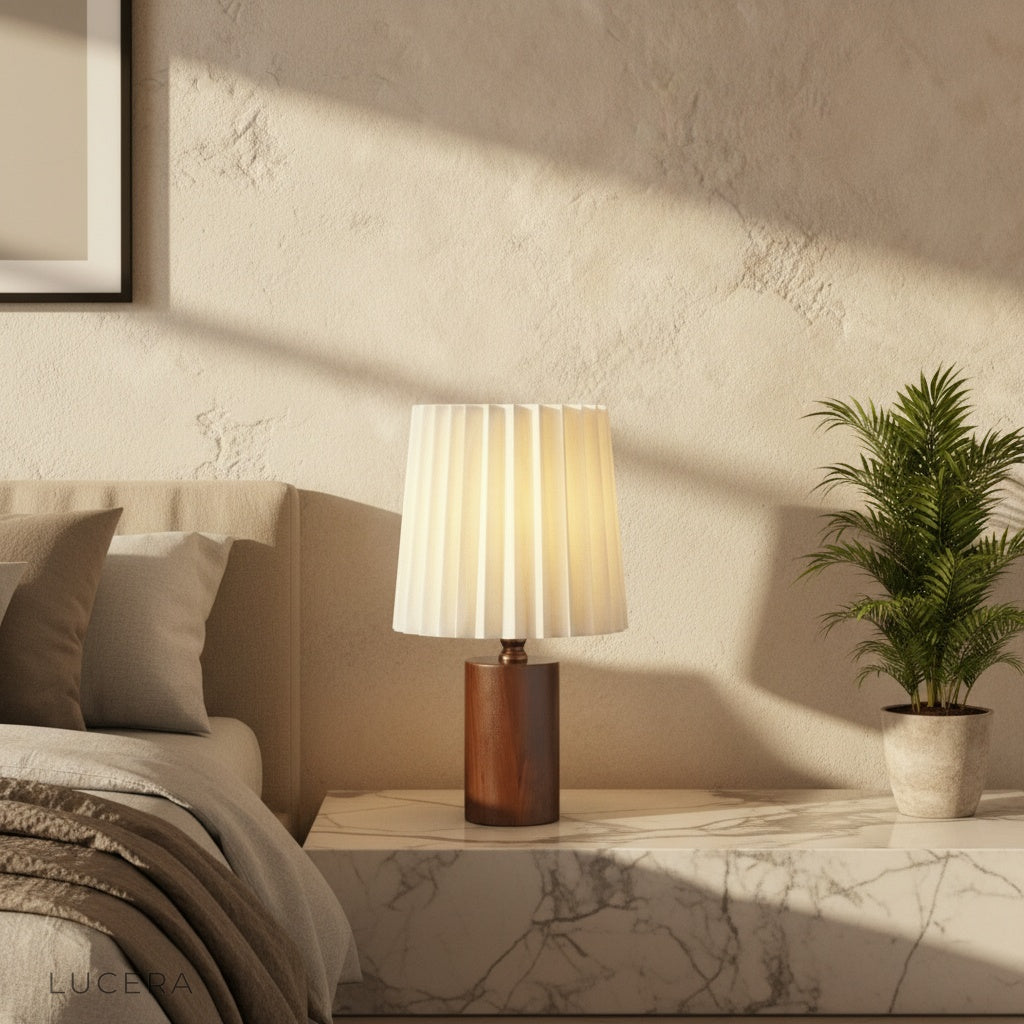 Pandora Table Lamp on wooden side table in cozy medieval-inspired living room with cream linen shade glowing warmly