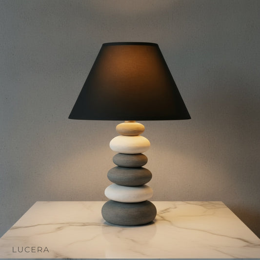 Celestine Table Lamp glowing warmly on a wooden console in a cozy modern living room