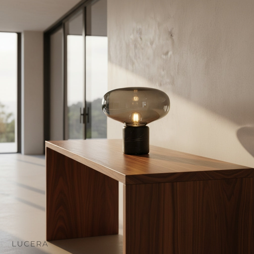 Elegance Table Lamp with hand-blown tinted glass shade and marble base on a modern living room sideboard