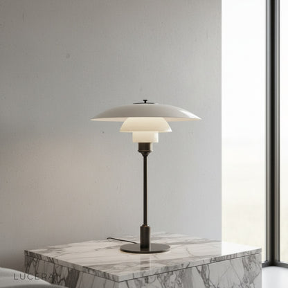 green glass baccarat table lamp on wooden bedside table in cozy bedroom