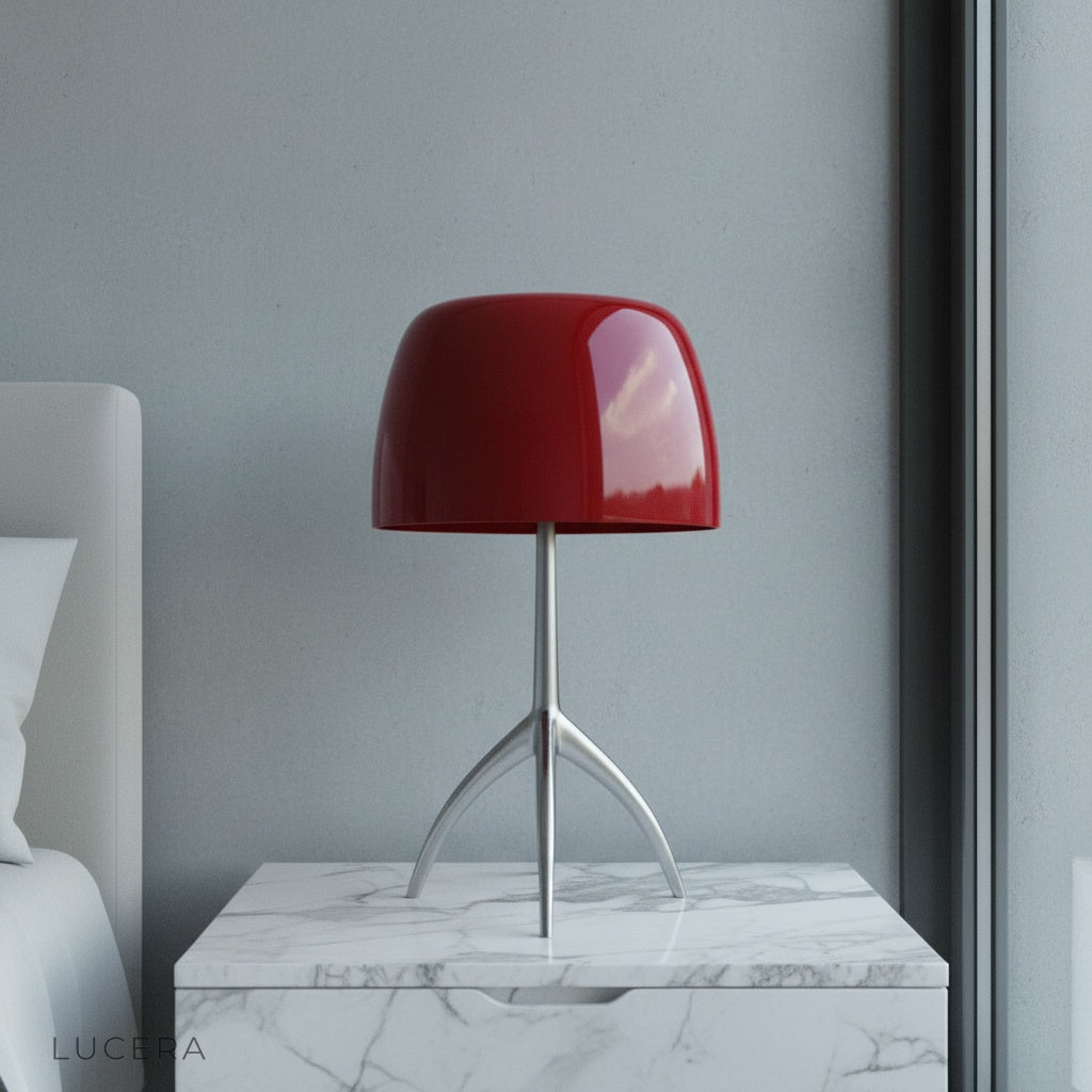Albescent Table Lamp glowing warmly on a mid-century modern bedside table in a cozy bedroom