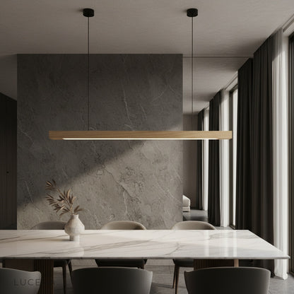 modern black walnut pendant light illuminating a cozy living room with soft ambient glow
