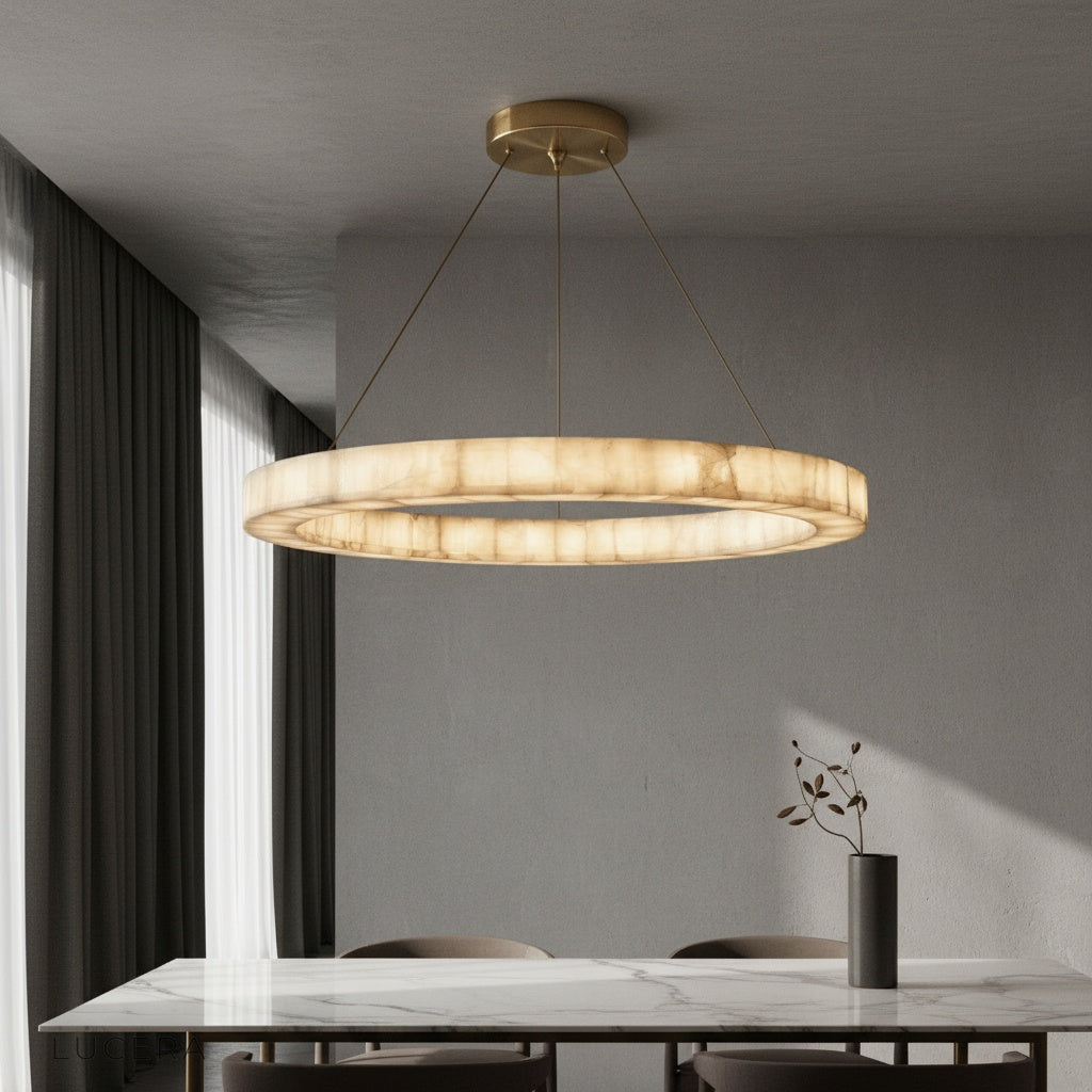 Bamboo Round Alabaster Chandelier glowing warmly above a modern dining table in a bright living room