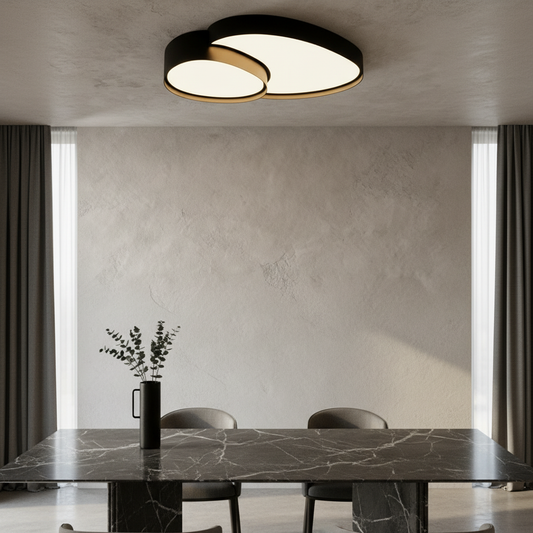 modern Yielding ceiling light glowing above a dining table in a minimalist living room