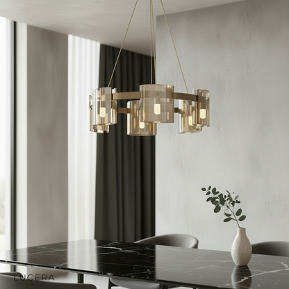 Cardinal Chandelier by Lucera glowing above a modern dining table with clear glass rings