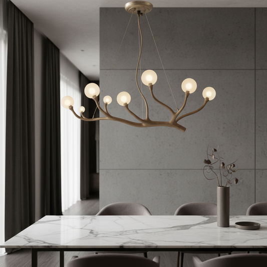 Xavier chandelier with glass shades hanging above a modern dining table in a bright living room