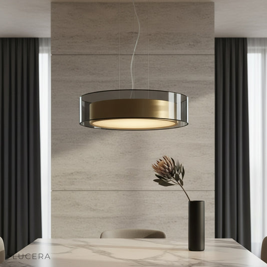 Kismet Pendant Light glowing over modern dining table in stylish living room