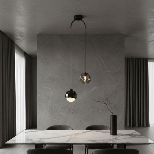 Vale pendant light by Lucera glowing above a modern dining table in an elegant living room