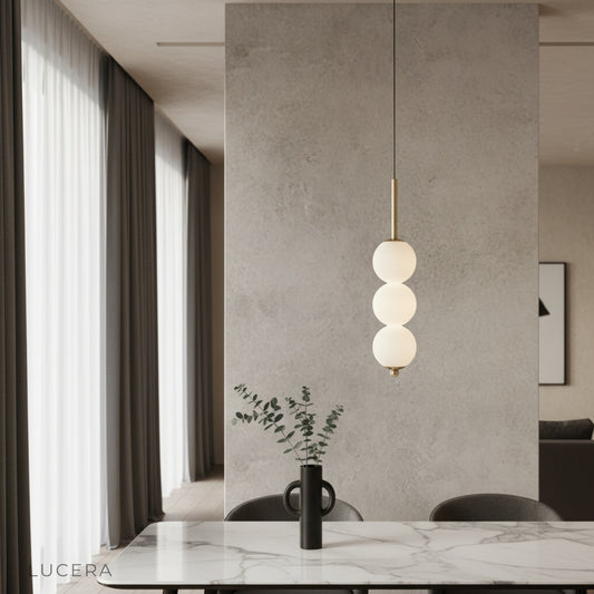 Meridian Pendant Light copper frame glass shades illuminating modern living room