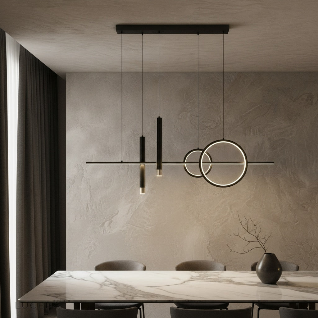Trim Pendant Light by Lucera glowing above a modern dining table in warm ambient light