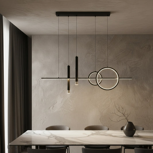 Trim Pendant Light by Lucera glowing above a modern dining table in warm ambient light