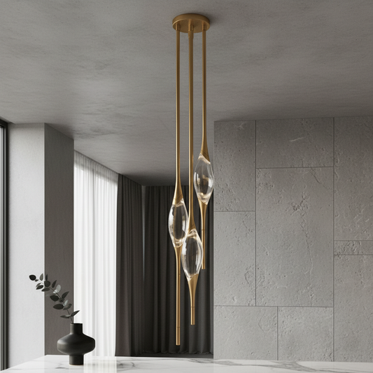 brushed gold Indus pendant light illuminating modern dining room with crystal drop