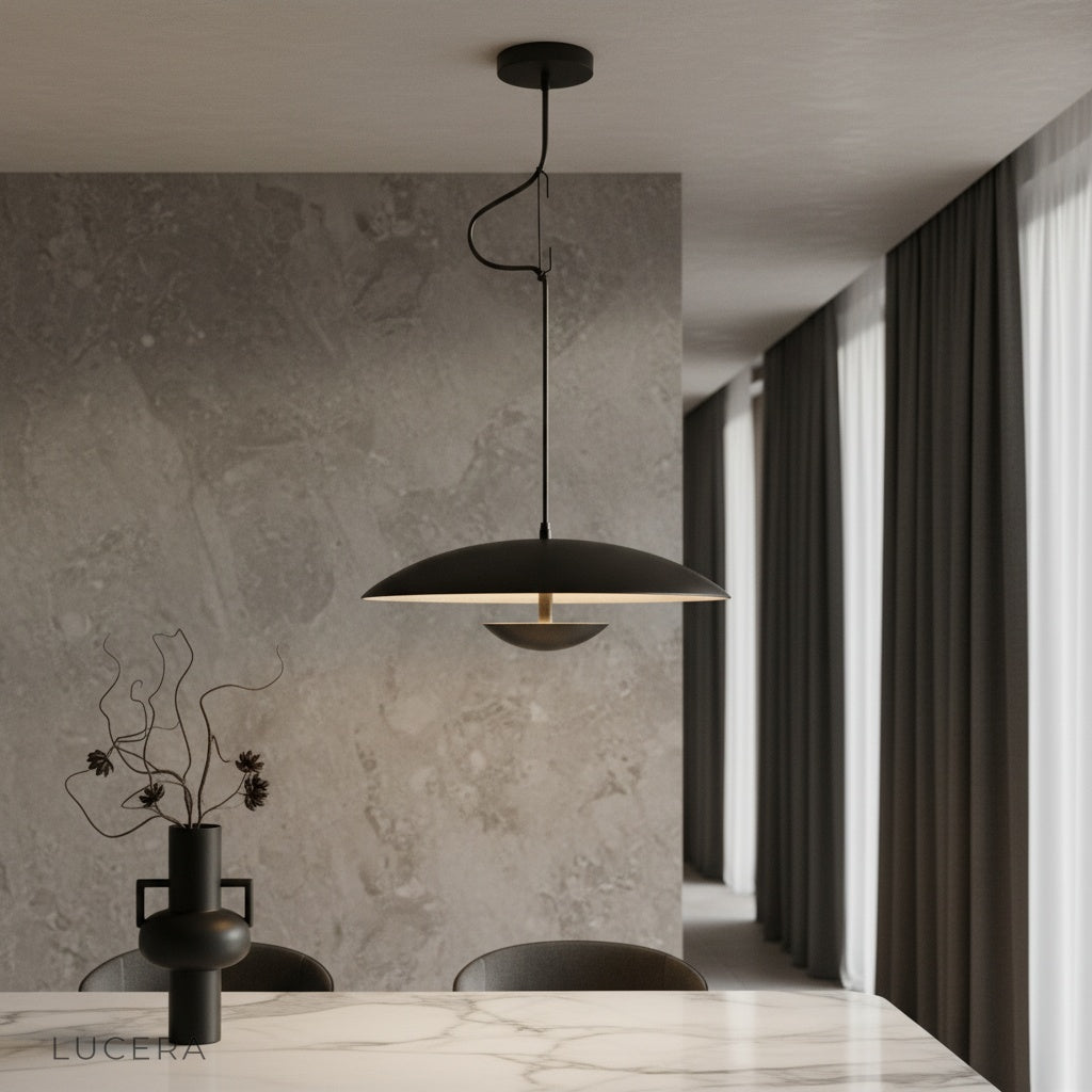 Cinder Pendant Light by Lucera hanging above a kitchen island in a modern minimalist home