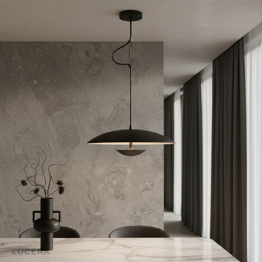 Cinder Pendant Light by Lucera hanging above a kitchen island in a modern minimalist home
