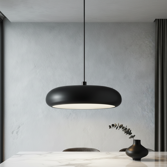 matte black dome pendant light illuminating dining table in modern home