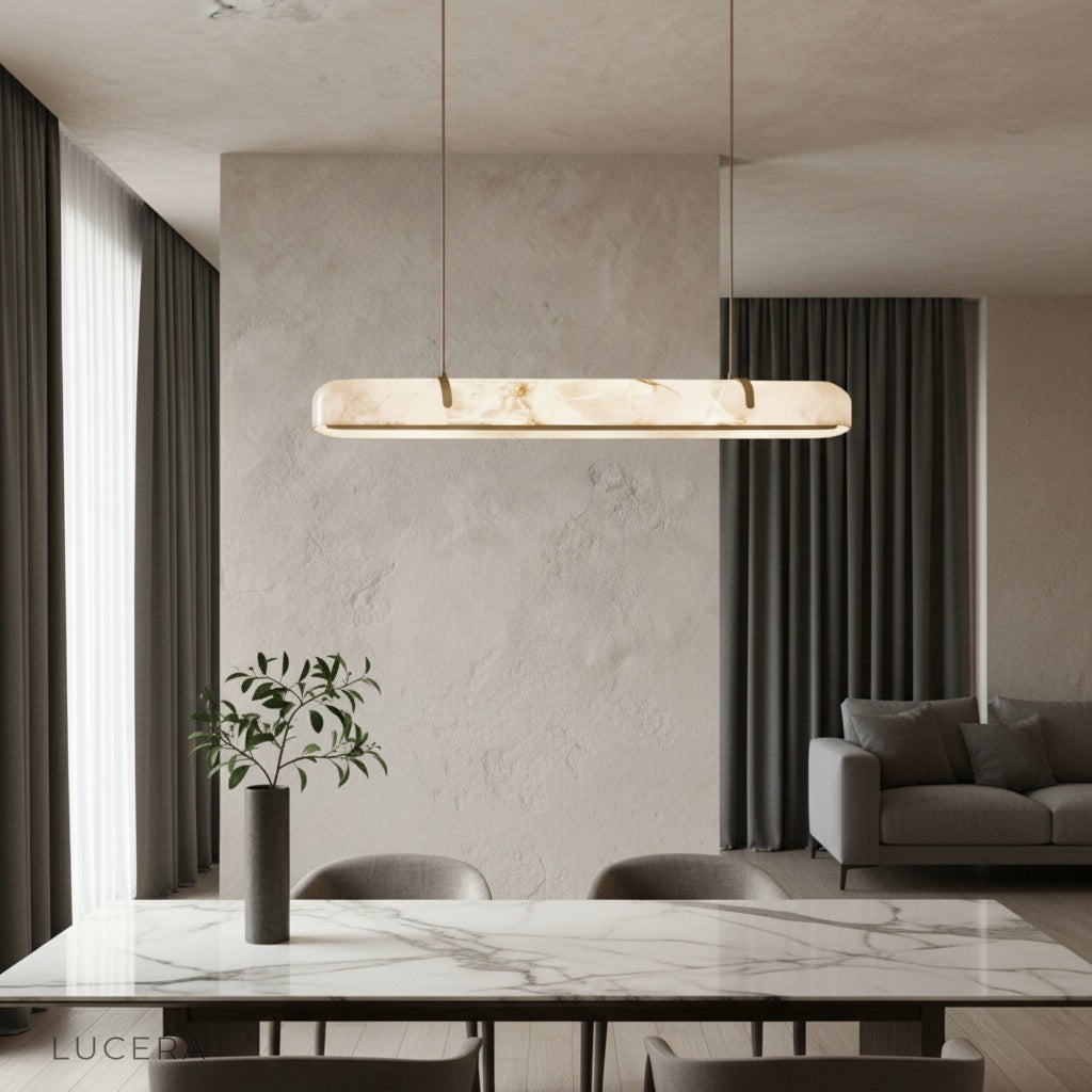 Nerissa chandelier with copper frame and alabaster shade illuminating a modern dining room table