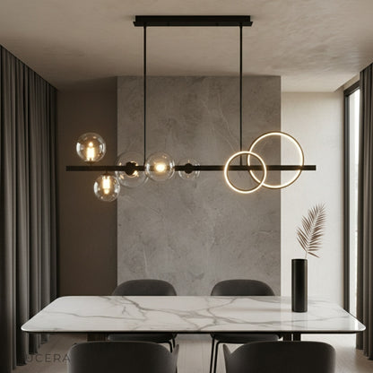 Mare pendant light glowing above modern dining table in contemporary living room