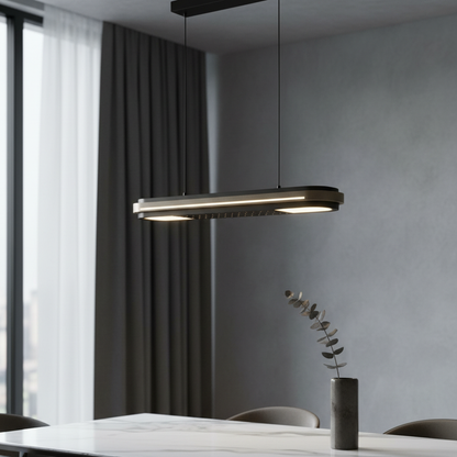 Nebulous Bravura pendant light glowing over modern dining table in minimalist living room