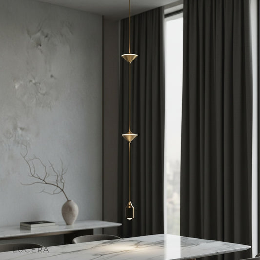 Abracadabra pendant light illuminating a modern minimalist bedroom bedside setup