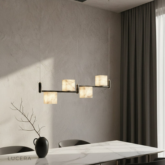 Lodge Alabaster Chandelier linear black frame glowing over modern dining table
