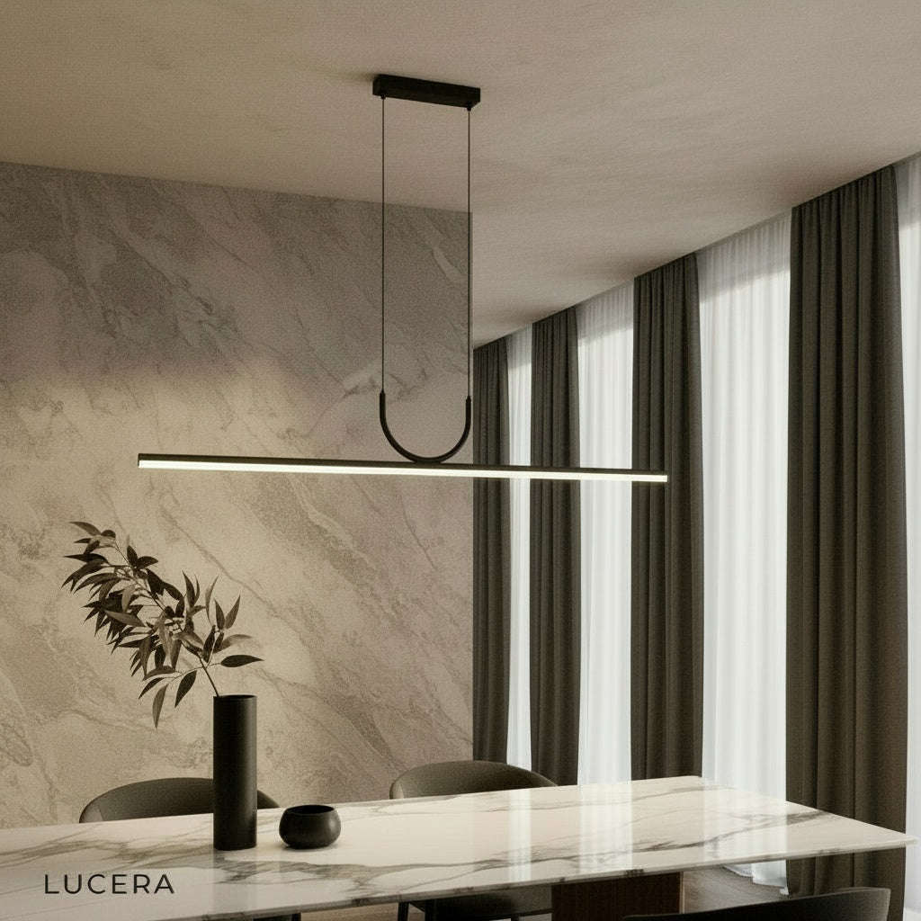 Honeysuckle linear pendant light illuminating a modern kitchen island in a bright open-concept home