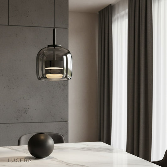 Mellifluous pendant light glowing over modern dining room table with warm LED ambiance