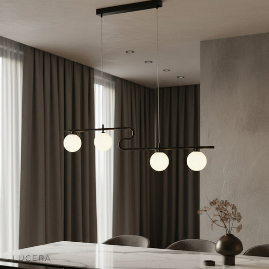 Quest pendant light with five opal glass globes illuminating a modern dining room