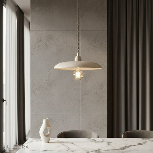Solstice pendant light with wooden dome shade illuminating a modern dining room