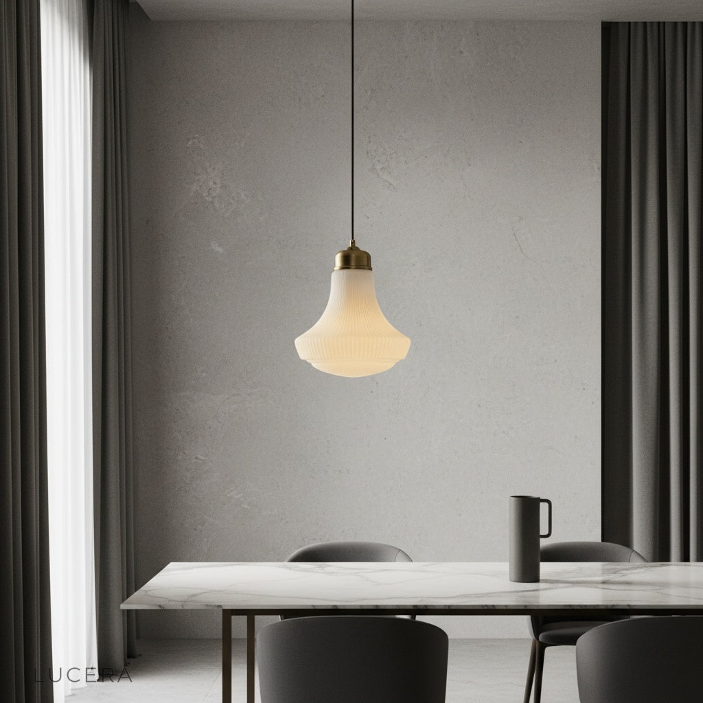 Chianti pendant light with striped glass shade glowing over a rustic kitchen island