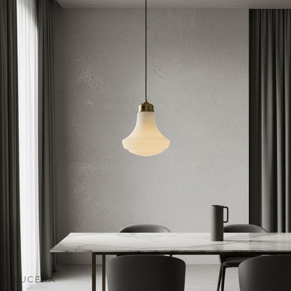 Chianti pendant light with striped glass shade glowing over a rustic kitchen island