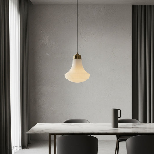 Chianti pendant light with striped glass shade glowing over a rustic kitchen island