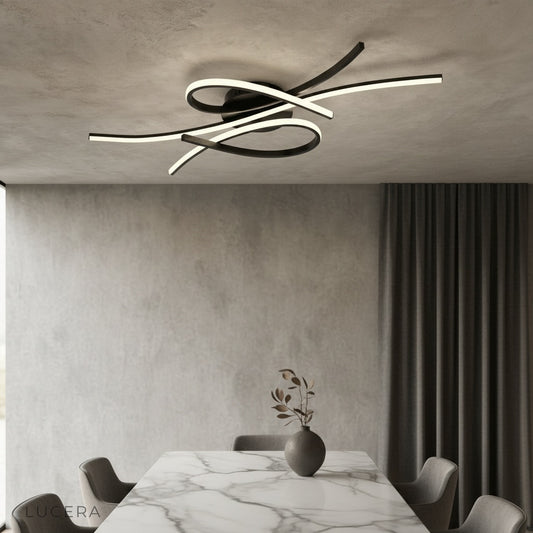 modern sculptural LED ceiling light illuminating contemporary living room