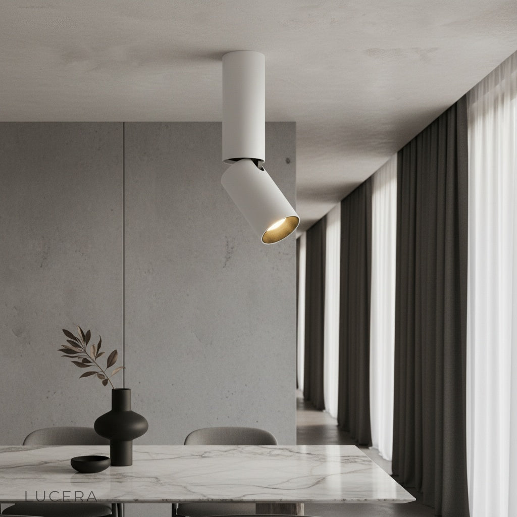 modern black Bewitch ceiling light illuminating a contemporary living room with sleek cylindrical heads