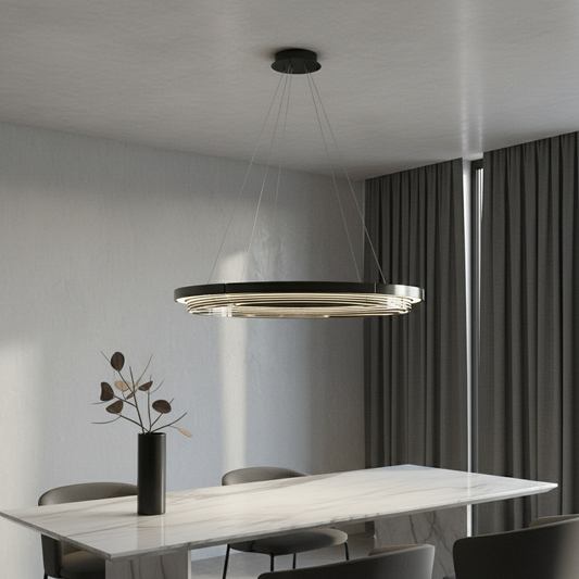 Zaffre dual ring LED chandelier glowing above modern dining table in open-concept living room
