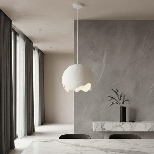 Vicar pendant light glowing over modern dining table in minimalist kitchen