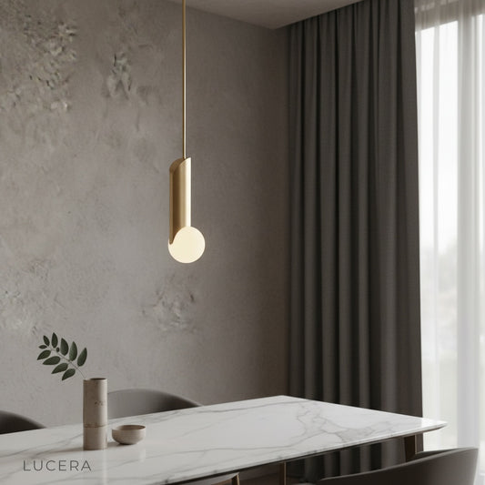 modern Yancy pendant light glowing over a cozy bedroom with frosted glass globe