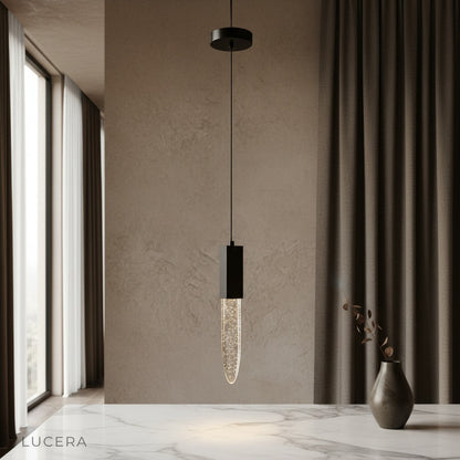 Terra pendant light glowing over modern dining table in minimalist living room