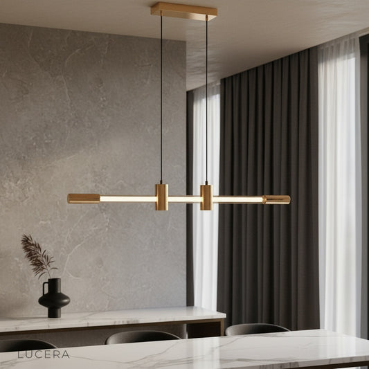 Gideon pendant light glowing warmly above a modern dining table in a stylish living room