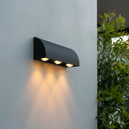 modern matte gray aluminum outdoor wall lamp with three lights mounted on exterior wall